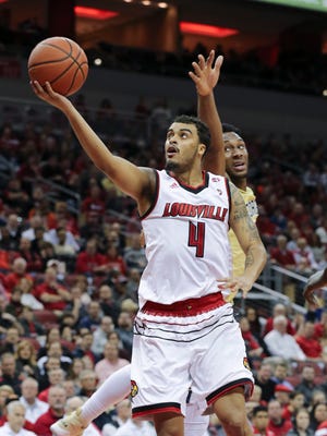 U of L’s Quentin Snider (4) attempts a layup against Georgia Tech during their game at the Yum Center.  Feb. 8, 2018