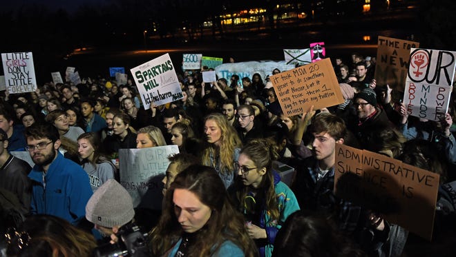 Signs displayed during the "March for Survivors and Change at MSU" on Friday, Jan. 26, 2018, at the Rock on the MSU campus in East Lansing. The event was organized as a show of support for sexual assault survivors and to spark a change to help prevent future sexual crimes on campus. Members of the MSU women's rowing team met with several members of the MSU Board of Trustees on Monday, Jan. 29, to discuss changing the culture at MSU.