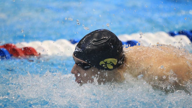 Iowa's Jerzy Twarowski competes in the 400 yard medley relay prelims at the NCAA swimming and diving championships at the Campus Recreation and Wellness Center on Thursday.