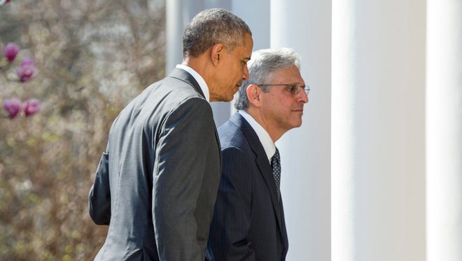 Judge Merrick Garland departs with President Obama after being introduced as Obama's nominee for the Supreme Court during an announcement in the Rose Garden of the White House on Wednesday.