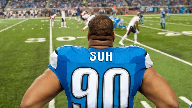 Detroit Lions defensive tackle Ndamukong Suh watches from the sideline against the Chicago Bears at Ford Field.