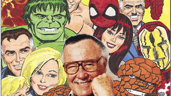 Spider-Man creator Stan Lee is surrounded by some...