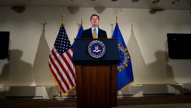 FBI Director James Comey, at FBI headquarters in Washington, announces the agency will not recommend criminal charges in its investigation into Hillary Clinton's use of a private email server while secretary of state.