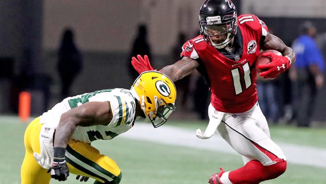 Green Bay Packers cornerback Quinten Rollins (24) gives up a catch top wide receiver Julio Jones (11) against the Atlanta Falcons Sunday, September 17, 2017 at Mercedes-Benz Stadium in Atlanta, Ga.