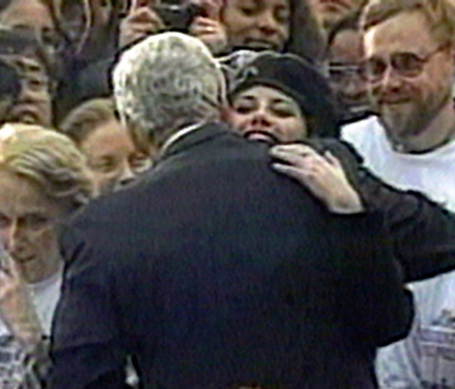 In this image taken from video, White House intern Monica Lewinsky embraces President Clinton as he greets well-wishers at a White House lawn party in Washington, D.C., Nov. 6, 1996.