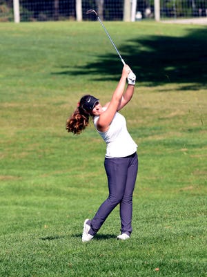Shelby senior Alexis Jones hits her approach shot on the 18th hole during the final round of the Division II state tournament on Saturday at Ohio State's Gray Course. Jones, who earned runner-up medalist after a 73, led the Whippets to a third-place finish.