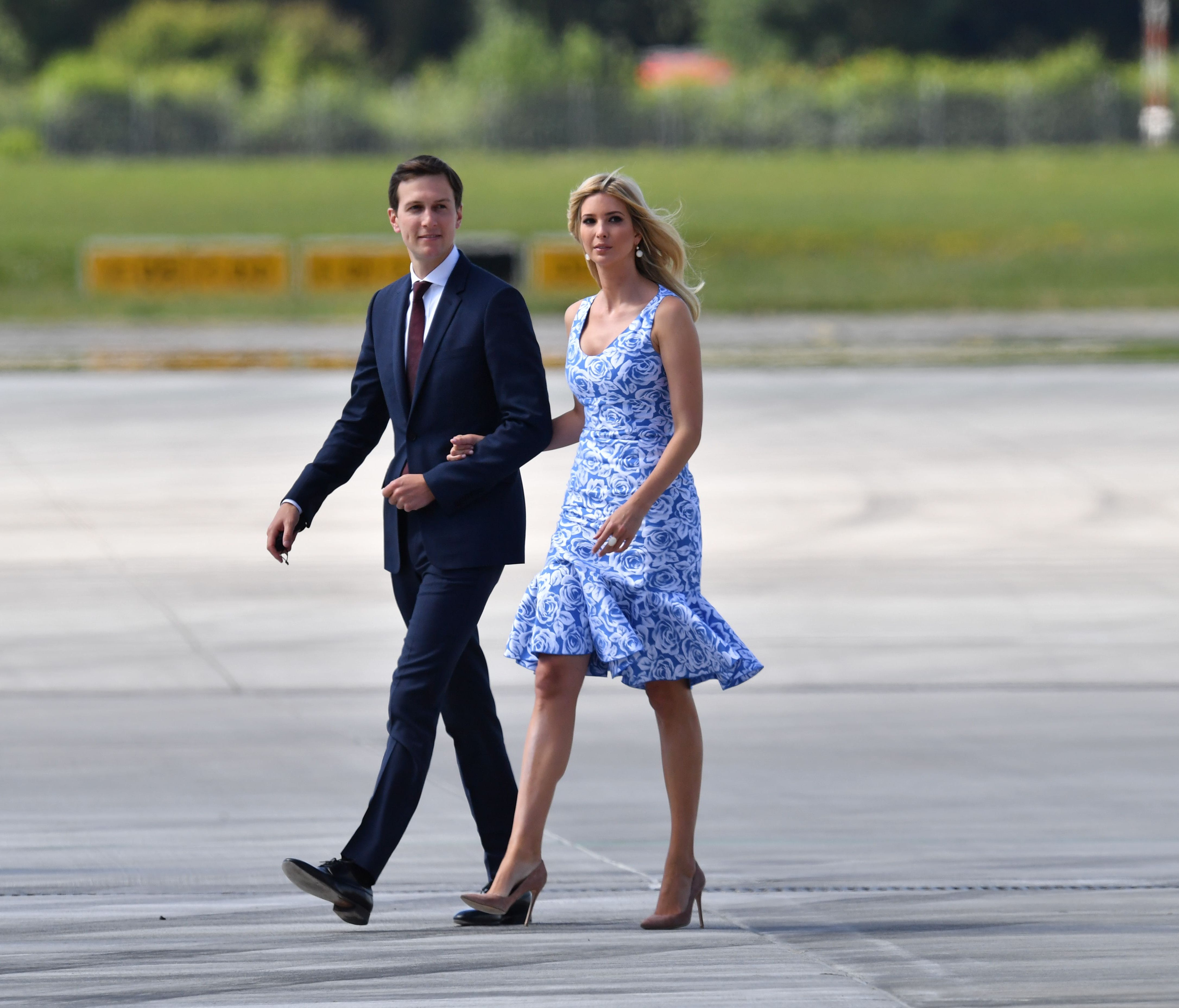 Kushner and wife Ivanka Trump make their way from  Air Force One to Marine One upon arrival at the airport in Hamburg on July 6, 2017.