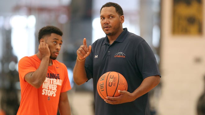 Former Pittsford Sutherland and Syracuse University basketball star Ryan Blackwell, right, chats with guard John Gillon during a practice for Boeheim's Army earlier this week. Boeheim's Army is playing in The Basketball Tournament, a $2 million, winner take all event featuring many former college basketball players.