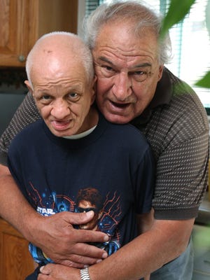 Anthony Porcile (left) of South Plainfield brings his brother Pete, 65, home for a visit almost every weekend from the Woodbridge Developmental Center. After 50 years, Pete is scheduled to be relocated to a more distant facility.