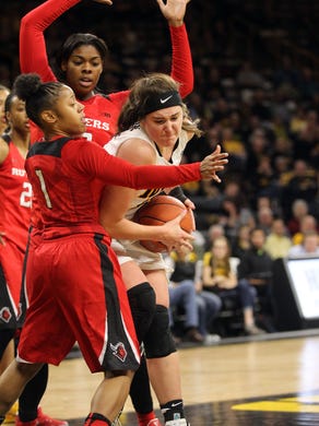 Iowa's Megan Gustafson fights off defenders during the Hawkeyes' game against Rutgers at Carver-Hawkeye Arena on Thursday, Feb. 2, 2017.