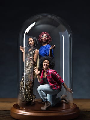 Breayre Tender (left), Jasmine Walker (front) and Ernest Bentley in Hilberry Theatre's production of "The Colored Museum." The play, which runs about 75 minutes without intermission, is broken into 11 sections, or exhibits, that explore  various facets of black history and culture.