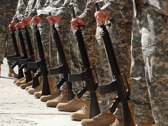 US soldiers stand to attention during a