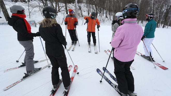 Brenda Zimmermann Thorpe, center right, instructs one of the Granite Peak Ski Area’s Women’s Turn ski clinic groups Feb. 25 at the top of a run.