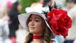A woman poses with her derby hat before the 2017 Kentucky