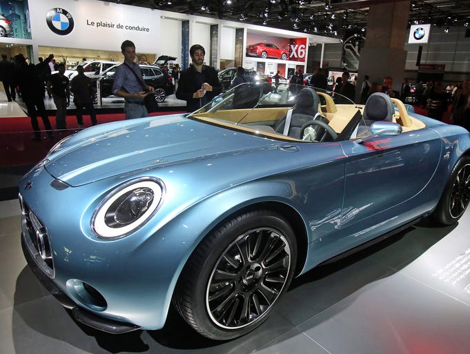 A Mini Superleggera is presented at the Paris Motor Show, in Paris, Friday Oct. 3, 2014. The Paris Motor Show will open its doors to the public on Saturday Oct. 4, until Oct. 19. European carmakers are hoping to impress with new models at this week's Paris Motor Show and prove they have come out stronger from years of economic trouble and cost-cutting. (AP Photo/Remy de la Mauviniere)