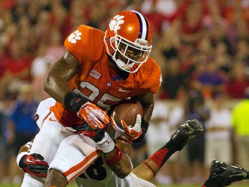 Clemson Tigers running back Roderick McDowell is tackled by Georgia Bulldogs safety Tray Matthews.
