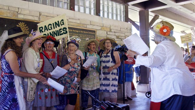 Demonstrators, including the Raging Grannies singing group, gather at Smolenski Park in Mount Pleasant, on June 28, to protest the groundbreaking for the Foxconn manufacturing plant, which will receive more than $4 billion in state and local taxpayer subsidies. At far right in the line is activist Sheila Plotkin, whose group, We the Irrelevant, has documented instances in which the Legislature has approved bills over strong public opposition. “Most people believe government no longer represents the people,” Plotkin said. “It represents campaign donors, special interests, the wealthy.”