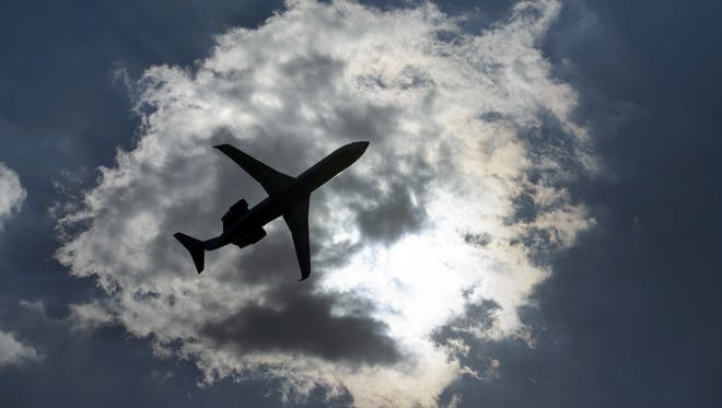 A jet takes off from Washington's National Airport  on July 24, 2015.