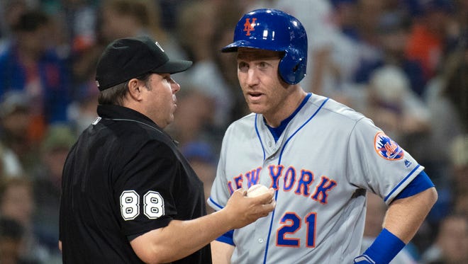 FILE - In this April 27, 2018, file photo, New York Mets' Todd Frazier, right, talks with umpire Doug Eddings during the team's baseball game against the San Diego Padres in San Diego. Frazier is asking for a meeting with Baseball Commissioner Rob Manfred over his growing frustration with the way umpires are calling balls and strikes. Frazier argued with home plate umpire Lance Barrett while New York was three-hit in a 7-0 loss to Atlanta on Wednesday night, then criticized umpiring around the league after the game.

“I’d like to sit down with Manfred or anybody at MLB and talk to them about it, because it’s rubbing everybody the wrong way,” Frazier said. “You have to be better than that.”