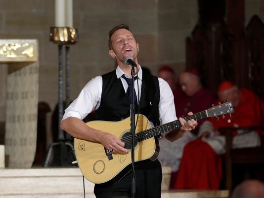 Chris Martin performs at Beau Biden's funeral