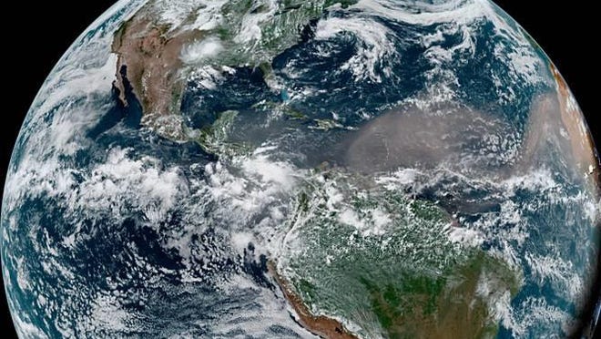 An image from June 21shows the cloud of dust associated with the Saharan Air Layer traveling into the Caribbean Sea toward the Gulf of Mexico.