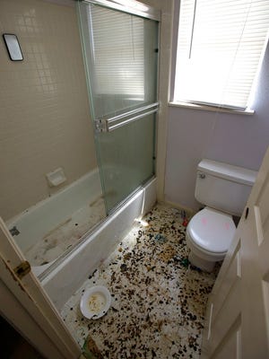 The bathroom is strewn with feces at a home in Fairfield, Calif., Monday, May 14, 2018, where authorities removed 10 children and charged their father with torture and their mother with neglect after an investigation revealed a lengthy period of severe physical and emotional abuse.