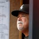 Chicago White Sox manager Rick Renteria (36) watches from the dugout during a baseball game against the Atlanta Braves Sunday, Sept. 1, 2019, in Atlanta. (AP Photo/John Bazemore)