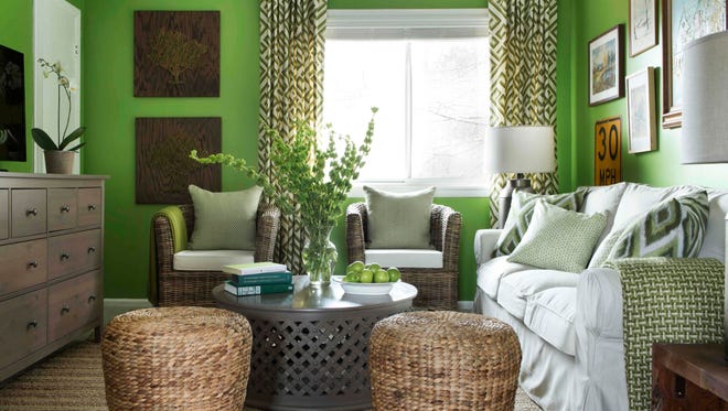 This photo provided by Brian Patrick Flynn/HGTV.com shows a living room designed for Dwell with Dignity by Flynn where he uses neutral accents to tone down the highly energetic tone of apple green wall paint. (AP Photo/Brian Patrick Flynn/HGTV.com, Sarah Dorio)