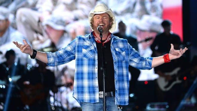 Toby Keith performs onstage during ACM Presents: An All-Star Salute To The Troops at the MGM Grand Garden Arena on April 7, 2014 in Las Vegas.