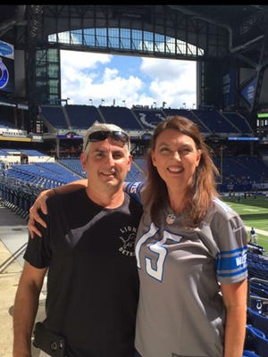 Detroit Lions fan Kim Esposito and her husband, Mike Esposito, of Grosse Ile pose in Indianapolis in Aug. 2017. They went to Indiana to see the Lions play the Colts in a preseason game.