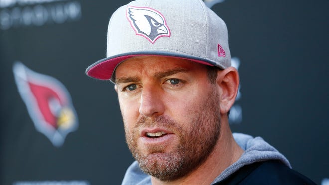 FILE - In this Wednesday, Oct. 11, 2017 file photo, Arizona Cardinals quarterback Carson Palmer answers a question during a news conference after practice at the team facility in Tempe, Ariz. Carson Palmer is retiring after 15 NFL seasons. Palmer, who turned 38 last week, made the announcement in an open letter released by the Cardinals, Tuesday, Jan. 2, 2018.(AP Photo/Ross D. Franklin, File)