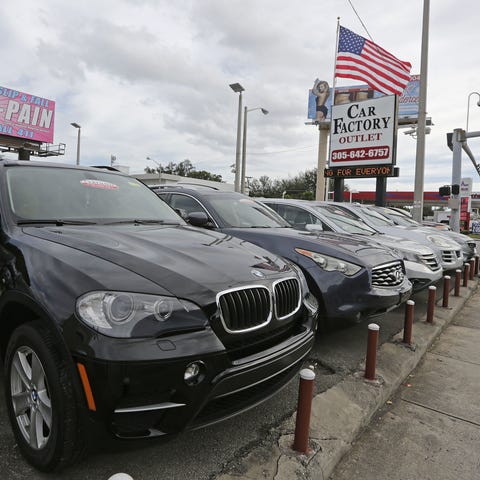 Certified pre-owned vehicles sit on display at an 