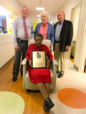 Clement's Kindness Fund dedicated a rocking chair in the BI-LO Charities Children’s Cancer in honor of retired nurse Ruth Cook (seated). Pictured with Cook, from left to right, are Dr. Cary Stroud, medical director of the Pediatric Palliative Care GHS Children’s Hospital, and Priscilla and Knox Haynsworth, founders of 
Clement’s Kindness.