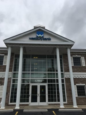 The parent company of Westbury Bank said net income decreased in the first quarter of its fiscal year because of expenses for a new office in the Madison area.