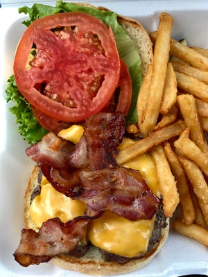 A bacon cheeseburger with fries from Haney's Cafe in San Carlos Park.