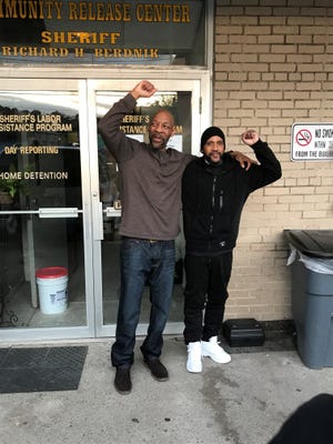 Eric Kelley, left, and Ralph W. Lee outside the Passaic County Jail. They were released from prison last April after serving 24 years in prison for a murder they did not commit.