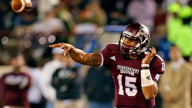 Oct 24, 2013; Starkville, MS, USA; Mississippi State Bulldogs quarterback Dak Prescott (15) passes the ball during the game against the Kentucky Wildcats at Davis Wade Stadium. Mandatory Credit: Spruce Derden-USA TODAY Sports