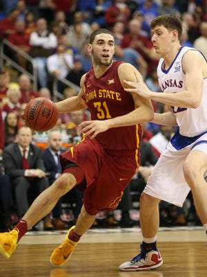 Iowa State's Georges Niang drives on Hunter Mickelson of Kansas during the Big 12 Championship title game between Iowa State and Kansas on Saturday, March 14, 2015, outside the Sprint Center in Kansas City, Missouri.