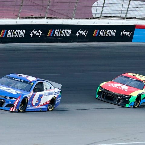 Kyle Larson (5) William Byron (24) head out of Tur