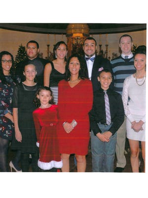 Photo of The Seidle family  provided by  the family attorney. Tamara Wilson-Seidle  in center with her 9 children. Her ex-husband, Neptune police Sgt. Philip Seidle is accused of killing Tamara .
