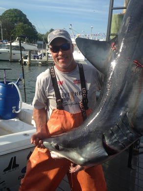 Capt. Jeff DeMuro, Fish Circus, with the 287-pound mako weighed in at the Brett Bailey Mako Rodeo.
