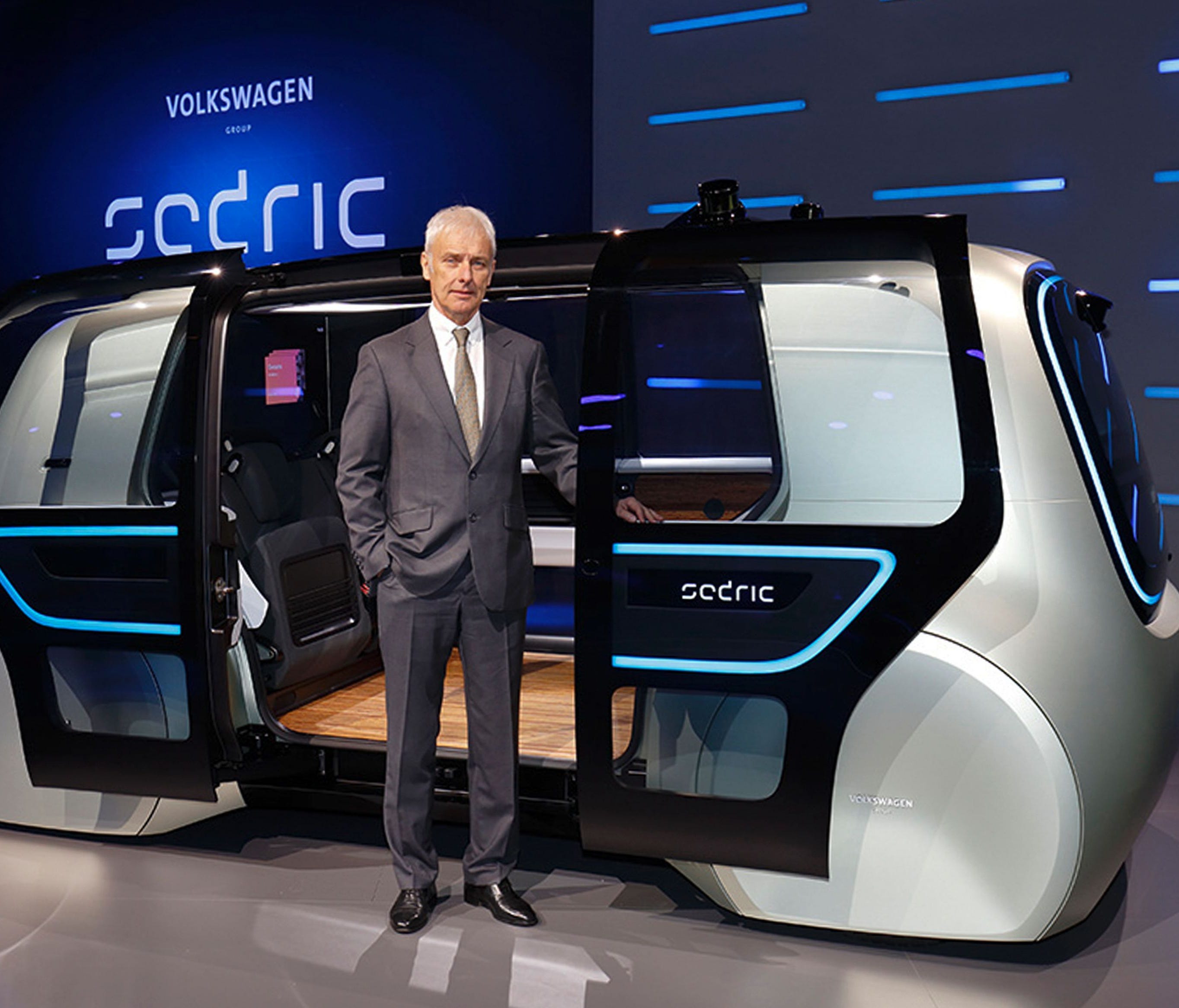 Volkswagen Group CEO Matthias Mueller posing with Sedric, the group's first autonomous car prototype