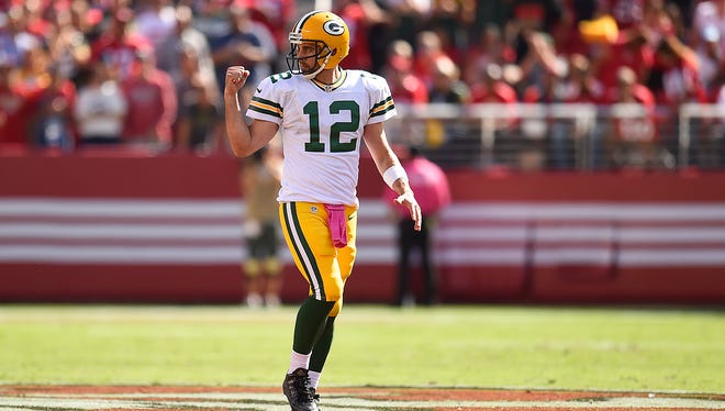 Packers quarterback Aaron Rodgers celebrates after a first half play against the 49ers at Levi's Stadium.