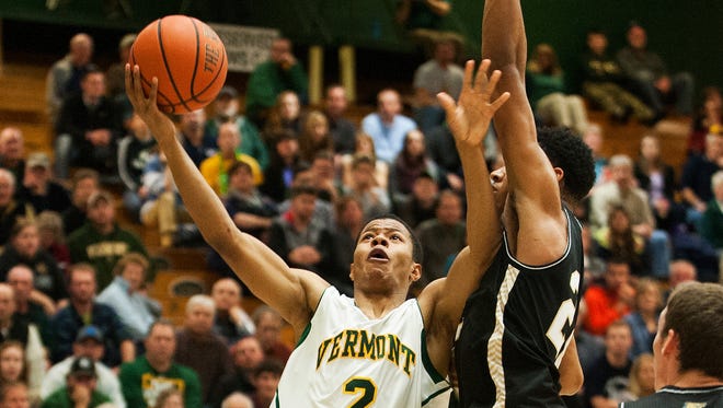 Vermontguard Trae Bell-Haynes (2) drives to the hoop for a layup against Bryant during last week’s game at Patrick Gym.