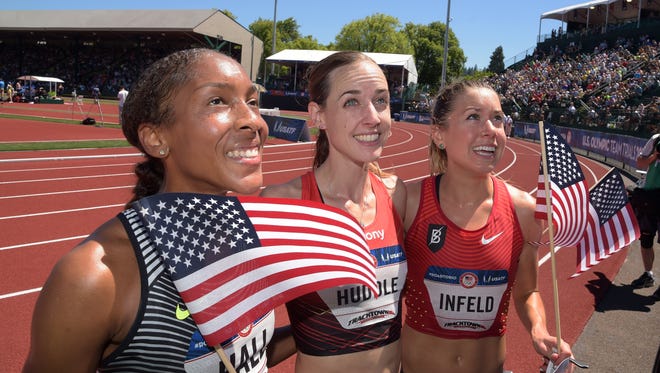Marielle Hall (left), Molly Huddle (middle) and Emily Infeld (right) react after finishing the women's 10, 000m finals in the 2016 U.S. Olympic track and field team trials at Hayward Field.