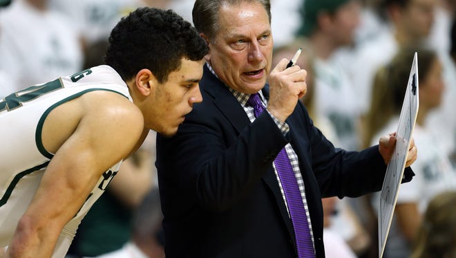 Michigan State Spartans head coach Tom Izzo talks to Michigan State Spartans forward Gavin Schilling (34) during the 1st half of MSU's 85-52 win Saturday in East Lansing.