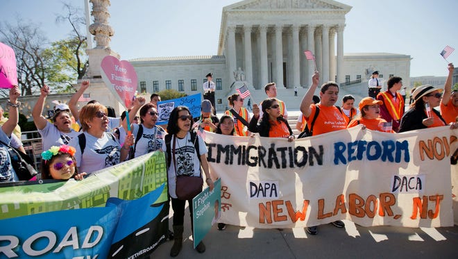 In this April 18, 2016, file photo, supporters of fair immigration reform gather in front of the U.S. Supreme Court in Washington. Supreme Court decisions in a half-dozen cases dealing with immigration over the next two months could reveal how the justices might evaluate Trump administration actions on immigration, especially stepped up deportations.