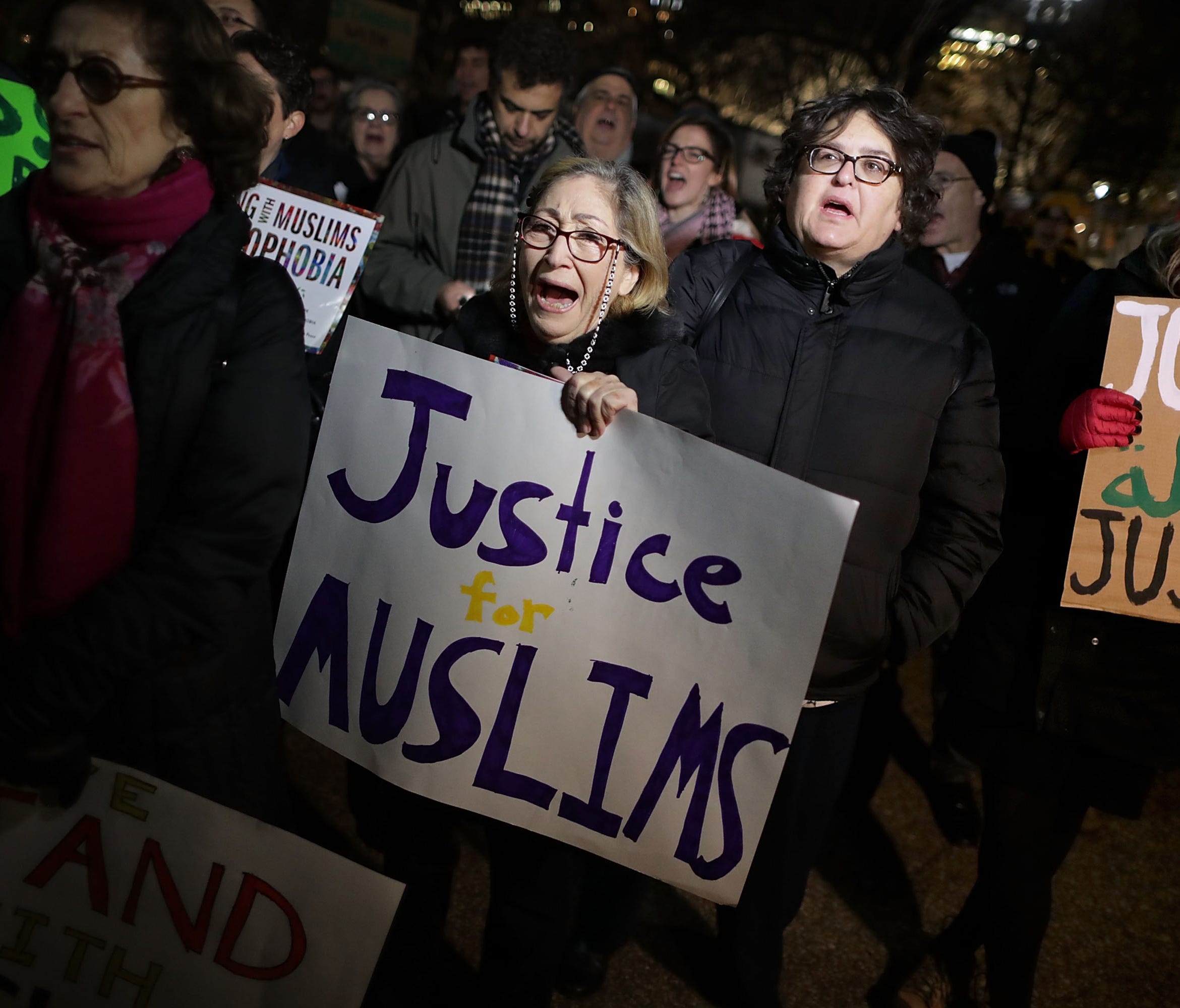 About 60 demonstrators organized by Jewish Voice for Peace gathered outside the White House to stand 'with Muslims against Islamophobia and racism' on Dec. 21, 2016, in Washington.