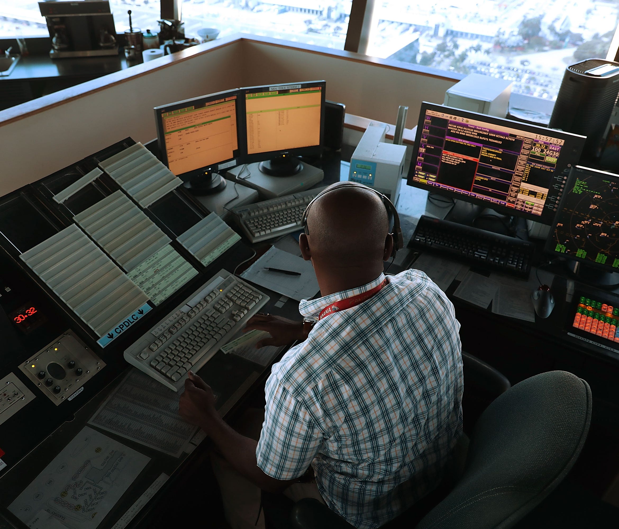 Air traffic controller Emil Watson uses Data Comm, part of the FAA's Next Generation Air Transportation System, in the control tower at Miami International Airport on March 6, 2017.