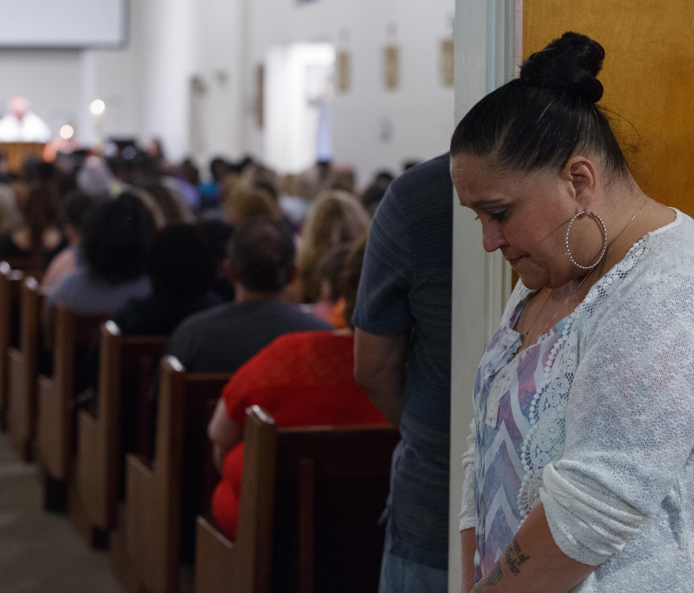Suzanne Sullivan cries during a prayer service at Our Lady of the Assumption Church in San Bernardino, Calif., following a school shooting at North Park Elementary School which left one student and a teacher dead, Monday, April 10, 2017.